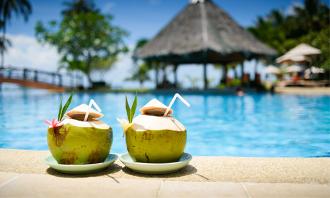 Exotic foreign holidays, Online Travel Agent. Coconuts by the pool.