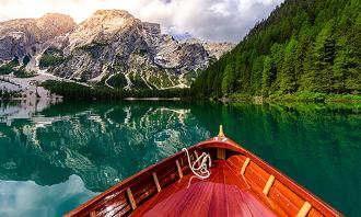 Wellbeing breaks, Online Travel Agent. boat on a still lake in Canada.